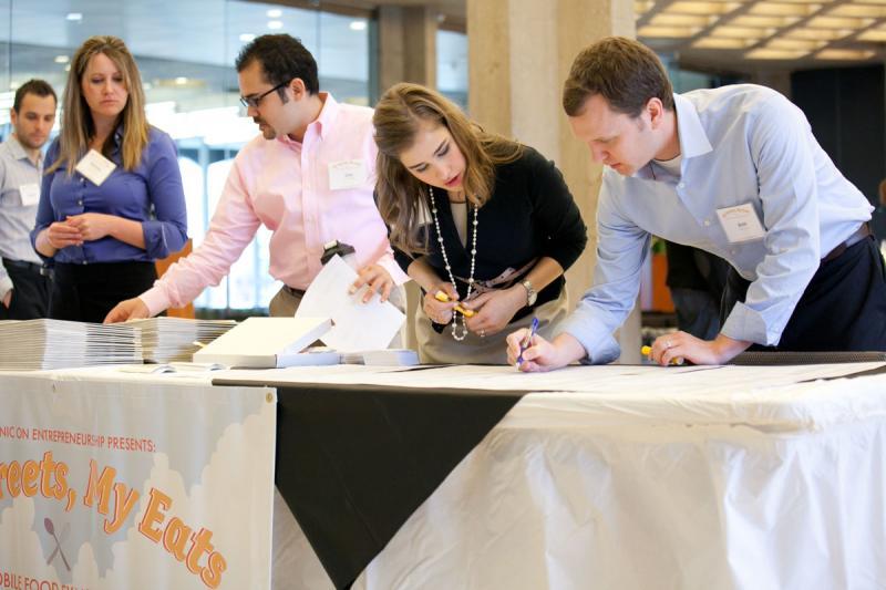 The Institute for Justice and Chicago Law students welcome attendees. The Institute for Justice and Chicago Law students welcome attendees.
