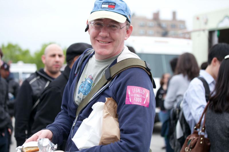 Several participants donned "Legalize Street Food" stickers. 