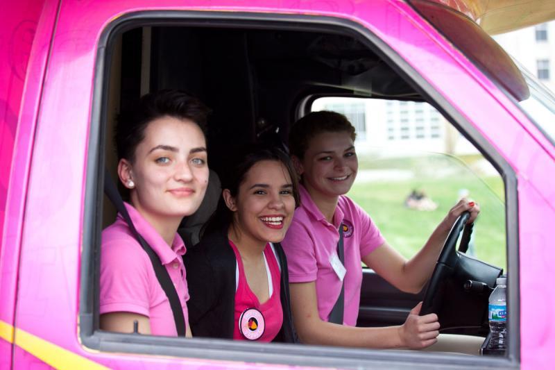 Forever Yogurt employees leave the parking lot in their pink truck. Forever Yogurt employees leave the parking lot in their pink truck.