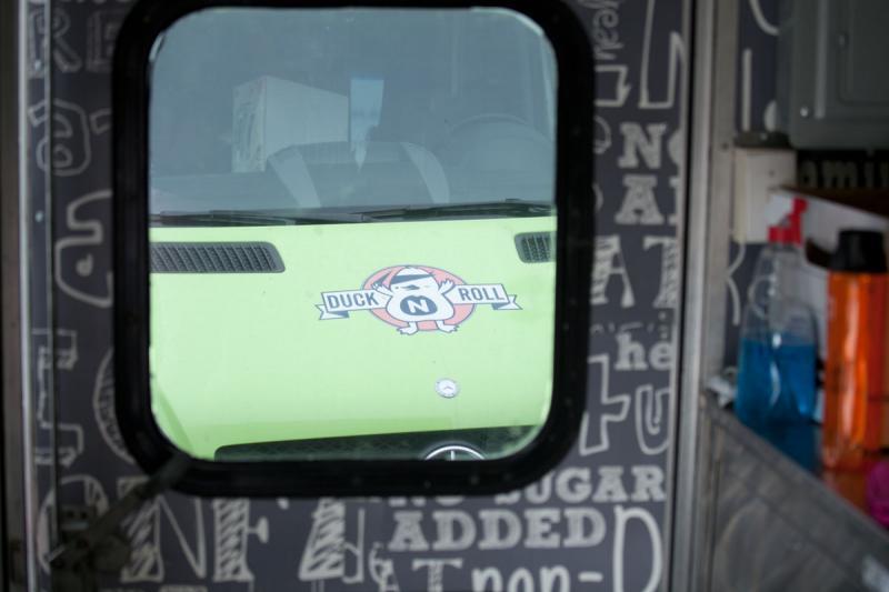 A view of the DucknRoll truck from inside the Forever Yogurt truck. 