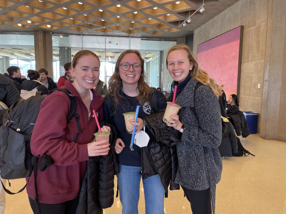 Three students with smoothies in hand.