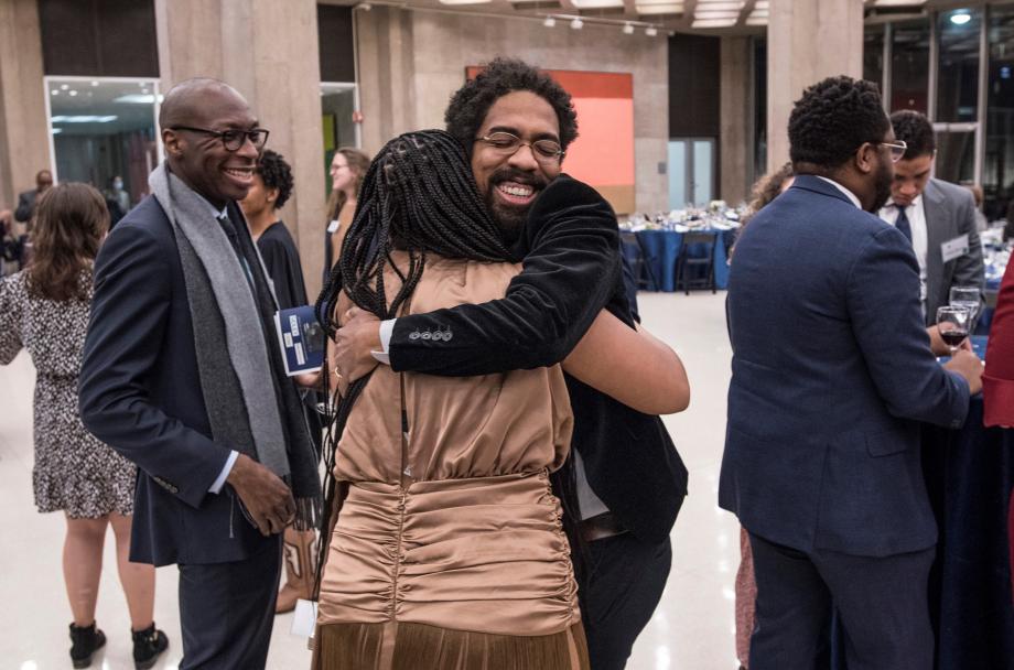 Many BLSA alumni are invited back for the Parsons Dinner each year, and it is a cherished opportunity to enjoy time with old friends. Andre Washington, '19, founder of the Parsons dinner, hugs Angel Russell-Johnson, '21. 