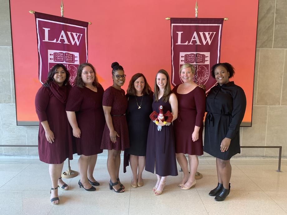 The UChicago Law Admission Team standing in front of banners.