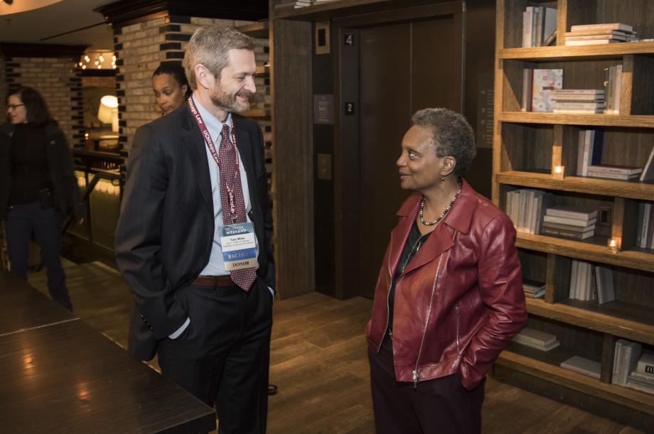 Dean Thomas J. Miles and Chicago Mayor-Elect, Lori Lightfoot, '89, chat at her class dinner.