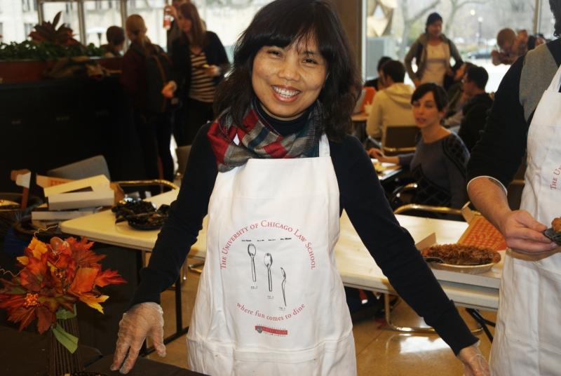 Aican Nguyen's apron says, "Where fun comes to dine." Aican Nguyen's apron says, "Where fun comes to dine."