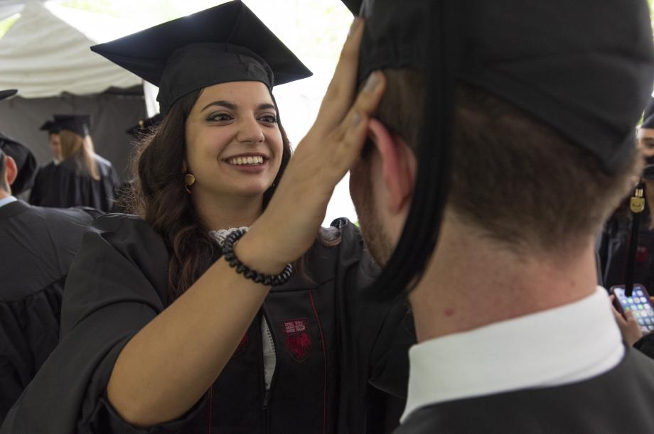 As they waited for the ceremony to begin, they chatted with classmates and helped each other prepare. As they waited for the ceremony to begin, they chatted with classmates and helped each other prepare.