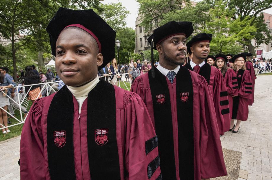 Before the Diploma and Hooding Ceremony began, graduates lined up outside Rockefeller Chapel. Before the Diploma and Hooding Ceremony began, graduates lined up outside Rockefeller Chapel.