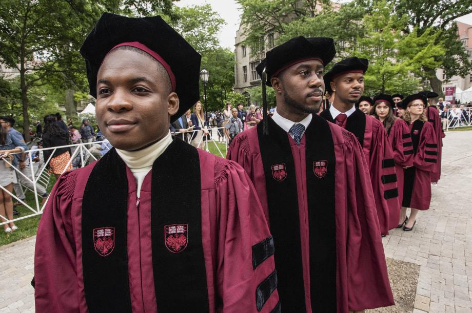 Before the Diploma and Hooding Ceremony began, graduates lined up outside Rockefeller Chapel.