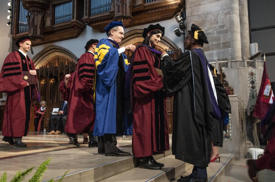 Four members of the faculty presented graduates with their hoods: Professors Douglas G. Baird (shown), Aziz Z. Huq (shown), Emily Buss, and Jonathan S. Masur. Four members of the faculty presented graduates with their hoods: Professors Douglas G. Baird (shown), Aziz Z. Huq (shown), Emily Buss, and Jonathan S. Masur.