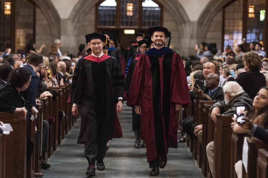 The faculty processed in first, led by Dean Thomas J. Miles (right) and Professor Jonathan Masur. The faculty processed in first, led by Dean Thomas J. Miles (right) and Professor Jonathan Masur.