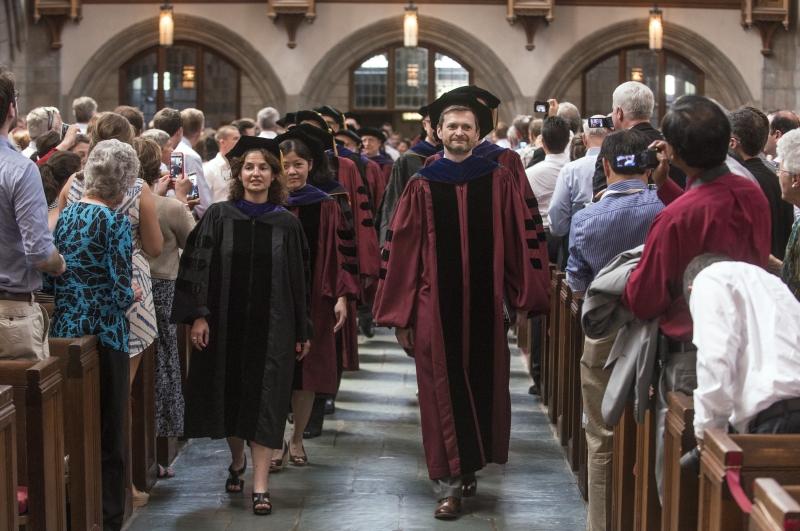 The procession was led by Dean Thomas J. Miles, the Clifton R. Musser Professor of Law and Economics, and D'Angelo Law Library Director Sheri Lewis. 