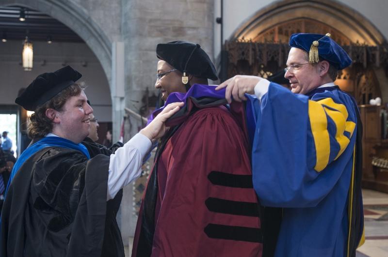 Kenneth Thomas, '16, was hooded by William Baude, the Neubauer Family Assistant Professor of Law, and Douglas Baird, the Harry A. Bigelow Distinguished Service Professor of Law.