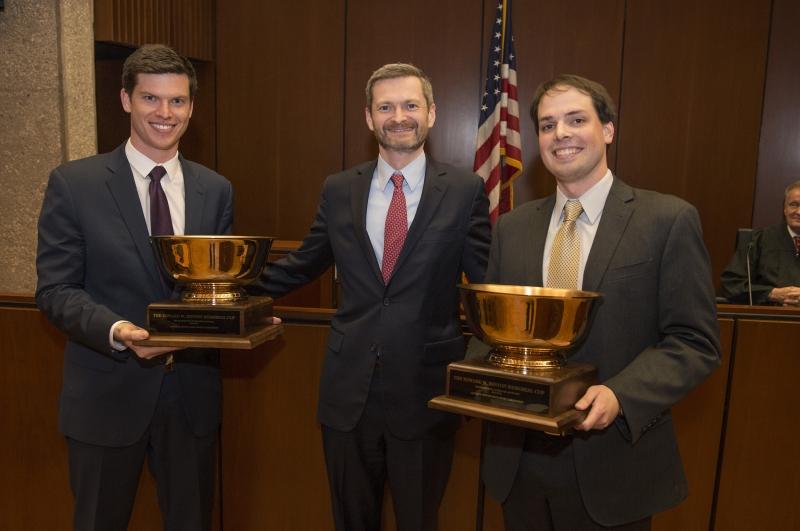 James Kilcup, ’17, and Eamonn Hart, ’16, took first place. They are shown with Law School Dean Thomas J. Miles, the Clifton R. Musser Professor of Law and Economics.