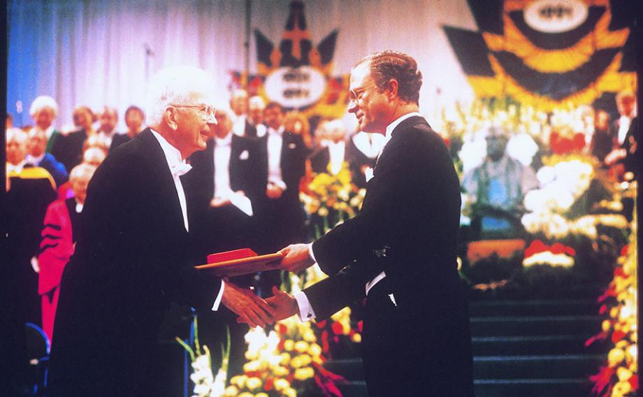 Ronald Coase receives the 1991 Alfred Nobel Memorial Prize in Economics from King Carl XVI Gustaf of Sweden