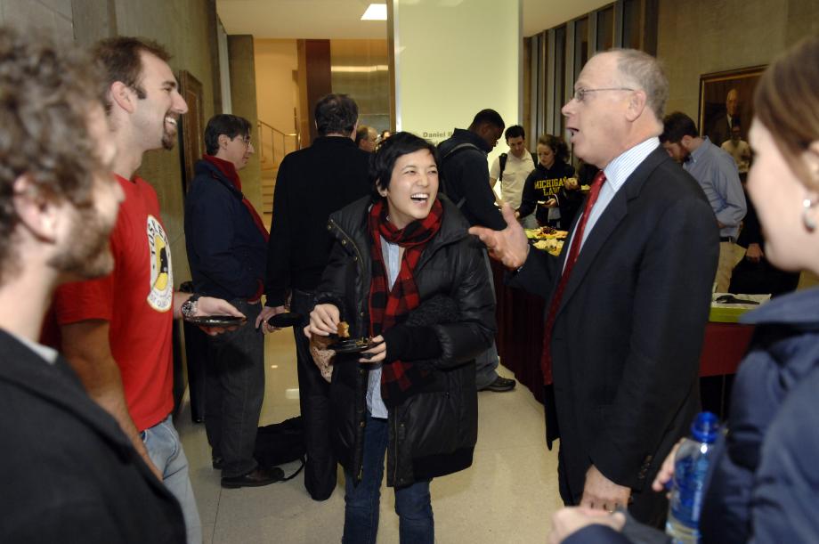 Students and professor in conversation