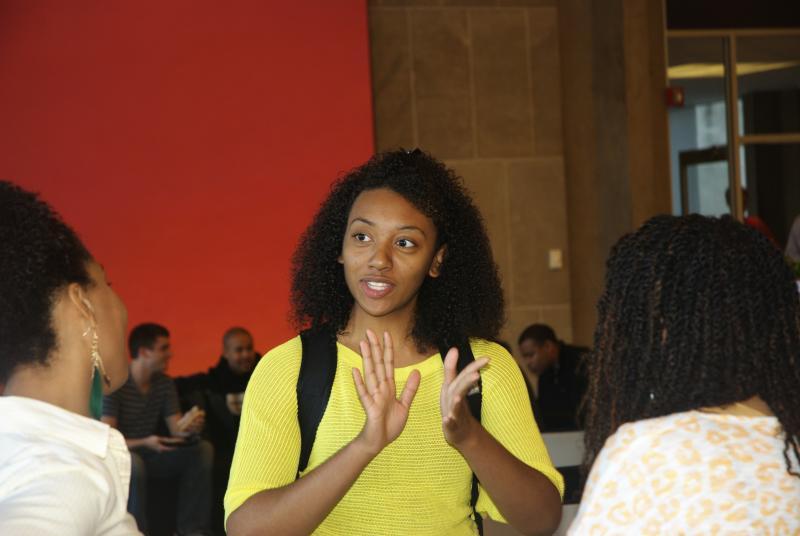 Jackie Newsome, '15, chats with friends. Jackie Newsome, '15, chats with friends.