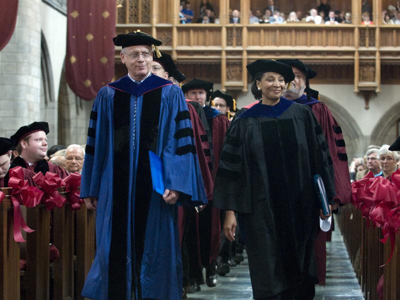 Dean and William B. Graham Professor of Law Saul Levmore, and Dean of Students Michele Richardson lead the faculty procession into Rockefeller Chapel for the Hooding Ceremony. Dean and William B. Graham Professor of Law Saul Levmore, and Dean of Students Michele Richardson lead the faculty procession into Rockefeller Chapel for the Hooding Ceremony.