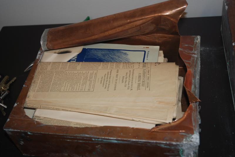 The boxes were made of copper sheeting and soldered shut against five decades of moisture. A pair of tin snips proved the best way to get in to see the contents. 