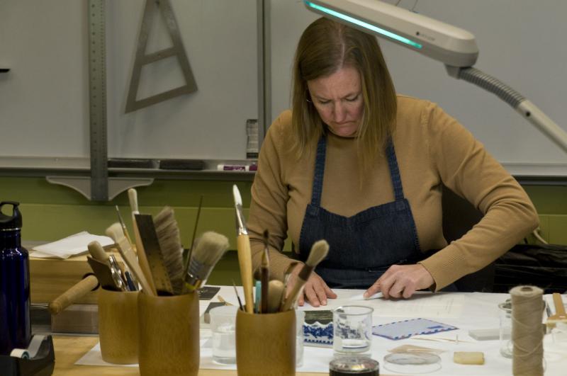 Ann Lindsey, the University Library's head of conservation, helped us access and preserve the materials in the boxes. Many folded papers and sealed letters needed careful opening. Ann Lindsey, the University Library's head of conservation, helped us access and preserve the materials in the boxes. Many folded papers and sealed letters needed careful opening.