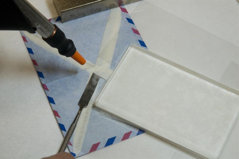 Ann Lindsey used a water vapor gun to gently release the seal on each envelope, damaging neither the envelope nor its contents. Ann Lindsey used a water vapor gun to gently release the seal on each envelope, damaging neither the envelope nor its contents.