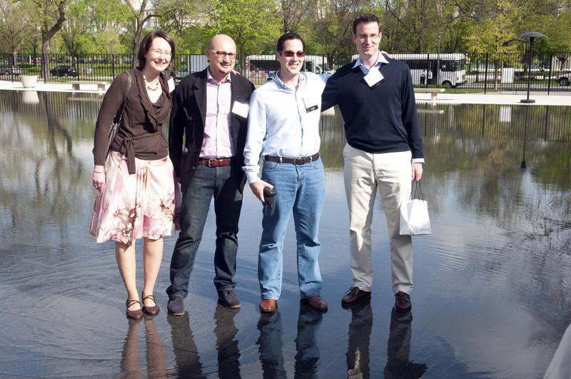 Alumni posing in the reflecting pool.