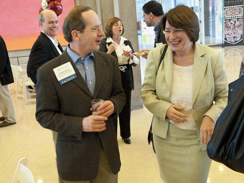 Profession Douglas Baird with U.S. Sen. Amy Klobuchar, '85.