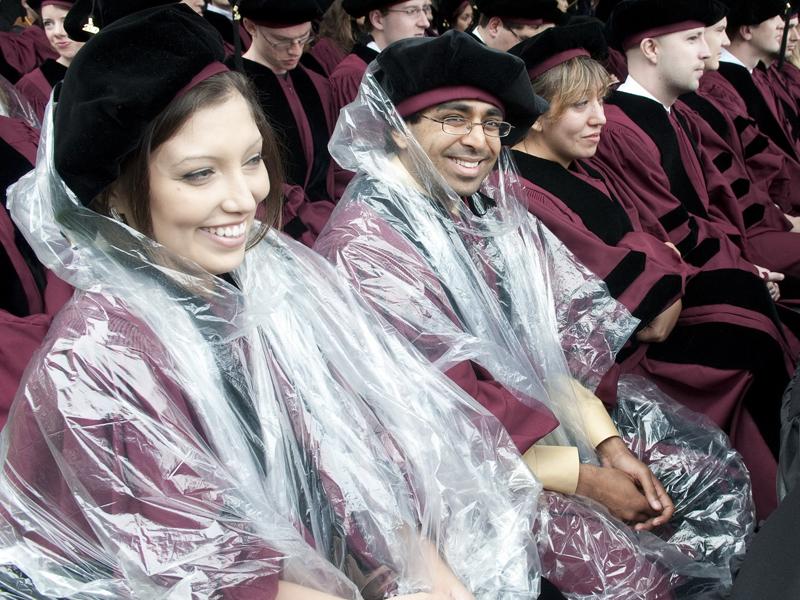 Student wearing poncho at commencement