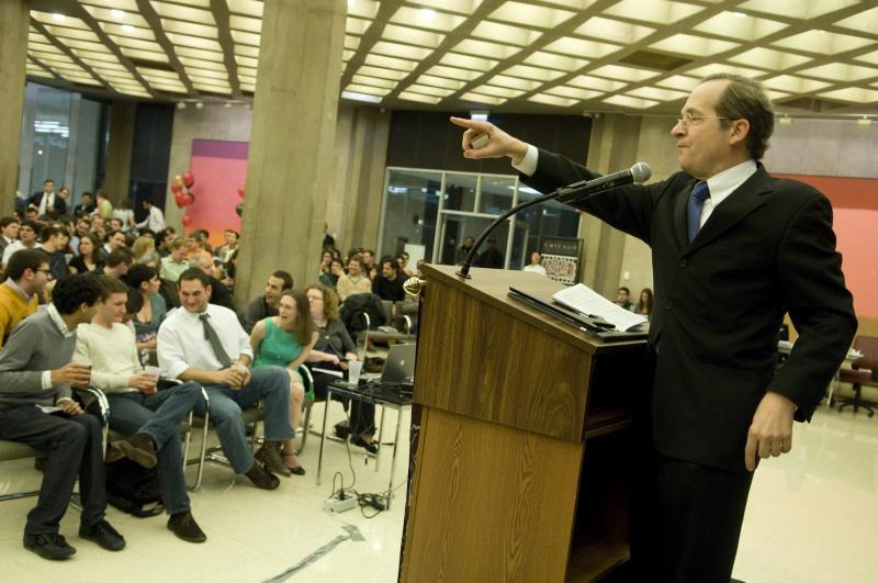 Professor Douglas Baird performed his traditional role as auctioneer. He wheedled, cajoled, and even gently shamed participants into ever-higher bids.