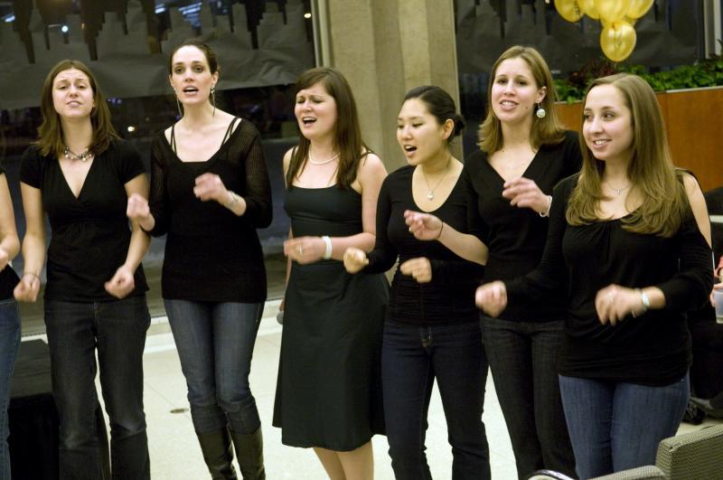 At a break in the live auction, the Law School's a cappella group, Scales of Justice, performed several songs.