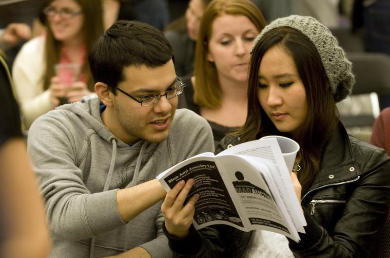 Victor Cruz and Nam Kim, both '12, carefully strategized as the Auction moved towards the final items.