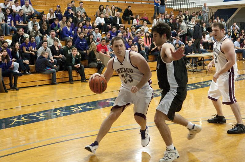 A Chicago Law player driving for a basket.