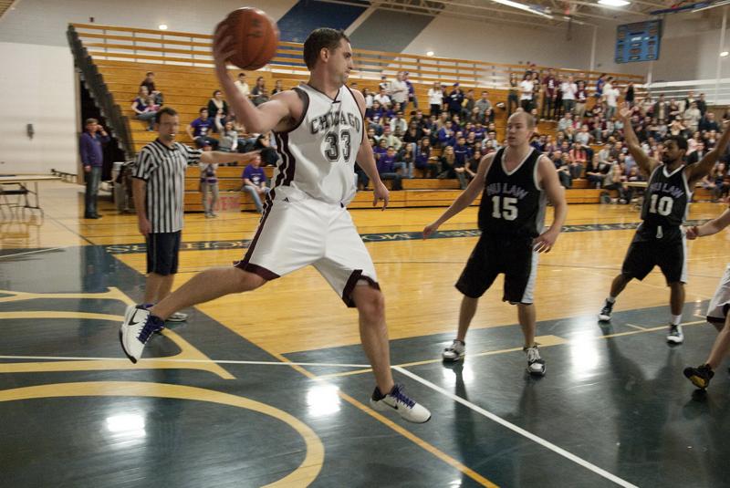 A Chicago Law player passing inbounds.