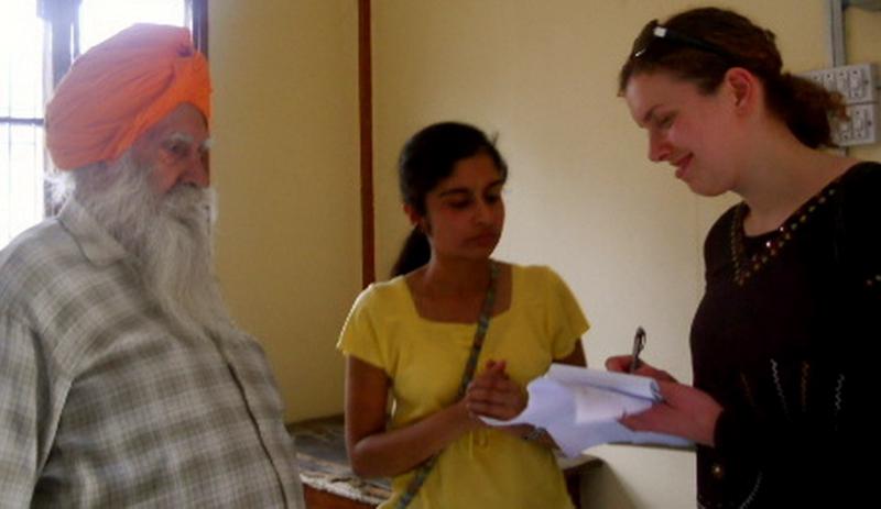 SSA student Deanna Lesht conducts an interview in the government flats in Jammu, India. University of Jammu psychology students provided translation for many of the group's interviews. SSA student Deanna Lesht conducts an interview