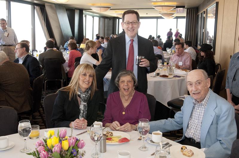 Dean Michael Schill with alumni at brunch. Dean Michael Schill with alumni at brunch.