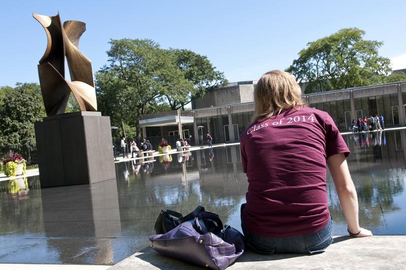 A 1L student takes in some sun by the Law School's reflecting pool. A 1L student takes in some sun by the Law School's reflecting pool.