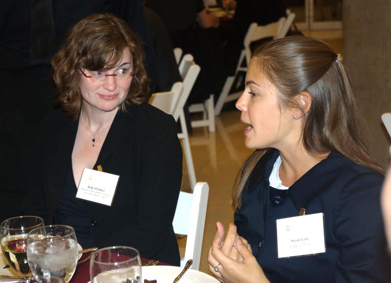 IJ Clinic Director Elizabeth Milnikel visits with a student at dinner. IJ Clinic Director Elizabeth Milnikel visits with a student at dinner.
