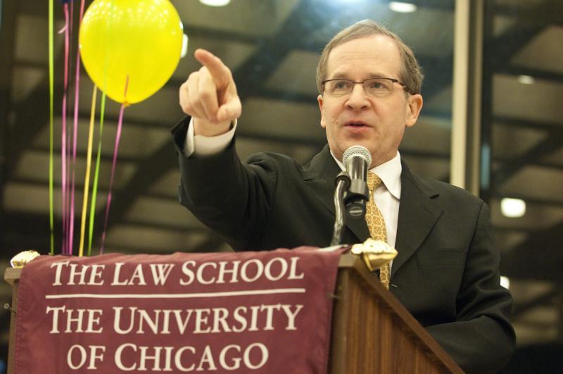 Professor Douglas Baird, a seasoned CLF auctioneer, mediates as students battle for the winning bid.