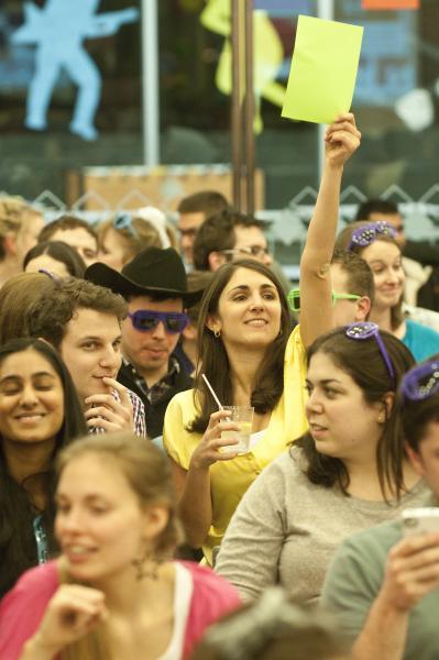 Students battle back and forth while cheering one another on to higher bids.