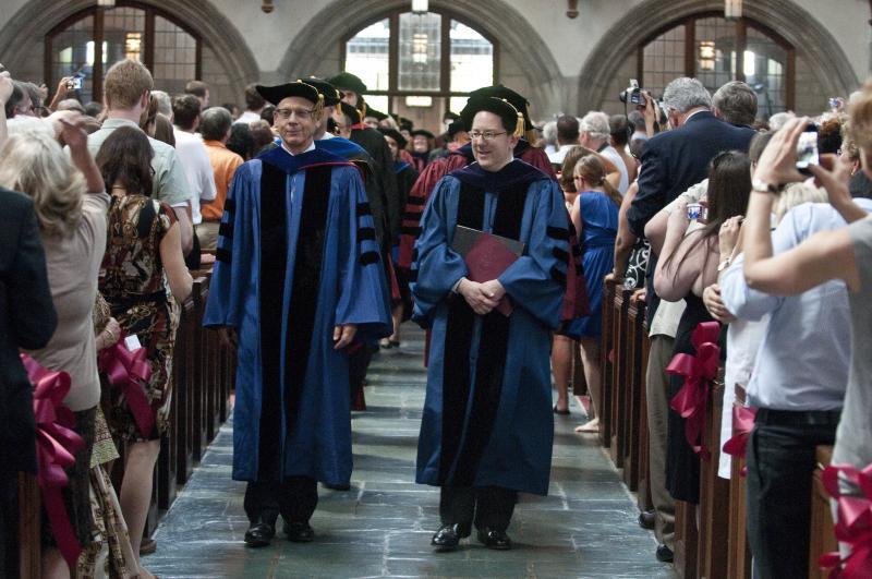 Prof. Saul Levmore and Dean Michael Schill enter Rockefeller Chapel. 