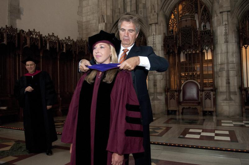 Some graduates were hooded by family members who were also alumni. Some graduates were hooded by family members who were also alumni.