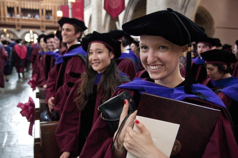 Armed with diplomas and hoods, the graduates were all smiles. Armed with diplomas and hoods, the graduates were all smiles.