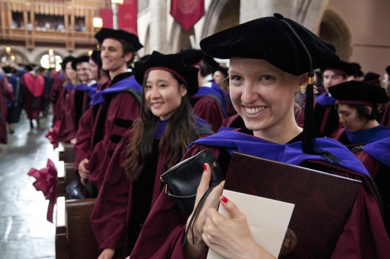 Armed with diplomas and hoods, the graduates were all smiles.