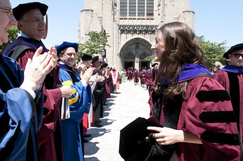 The faculty lined up outside Rockefeller to congratulate the new graduates.