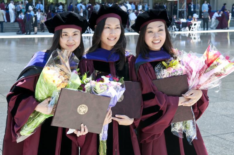 Some families came armed with flowers for new graduates. Some families came armed with flowers for new graduates.