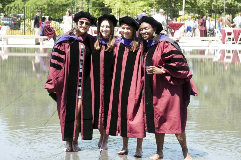 Despite the heat, many graduates were proud to keep their robes on. 