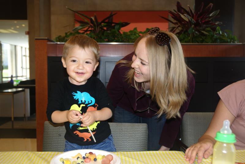 The kids enjoyed hot dogs, hamburgers, and fruit. 