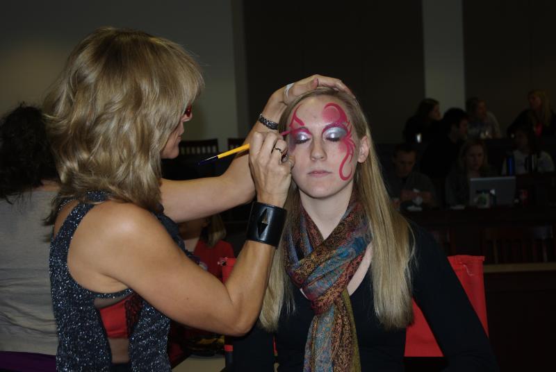 This student got her face painted in Room 5 while a scary movie played.