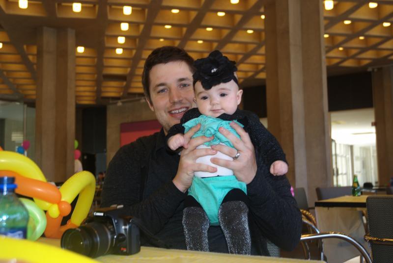 Chris Mortorff, '13, and his infant daughter.