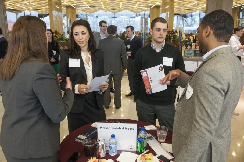 Lawyers handed out business cards and law firm "swag" like pens and bags.