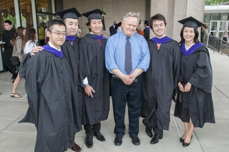 Assistant Dean for Graduate Programs Dick Badger with a handful of LLMs.